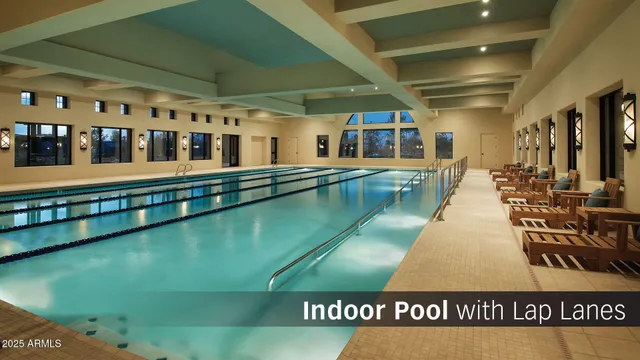 an aerial view of a residential houses with outdoor space