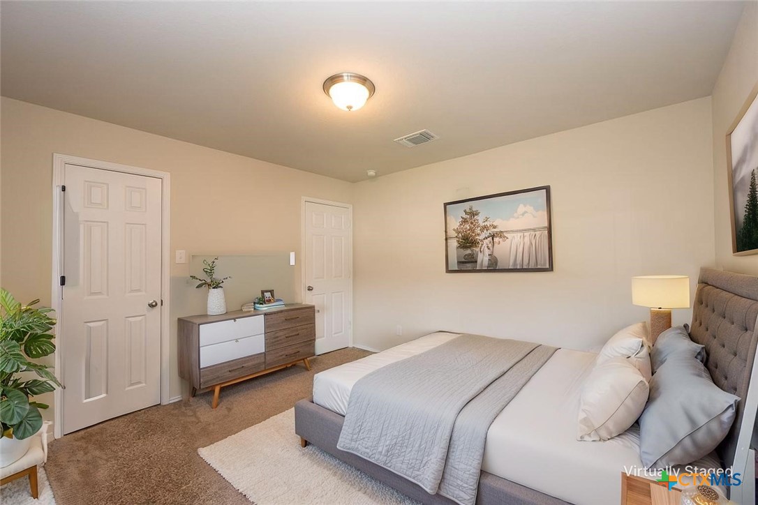 2511 Pintail Loop Copperas Cove, TX 76522 - Photo 18 of 26 a bedroom with a bed and a couch