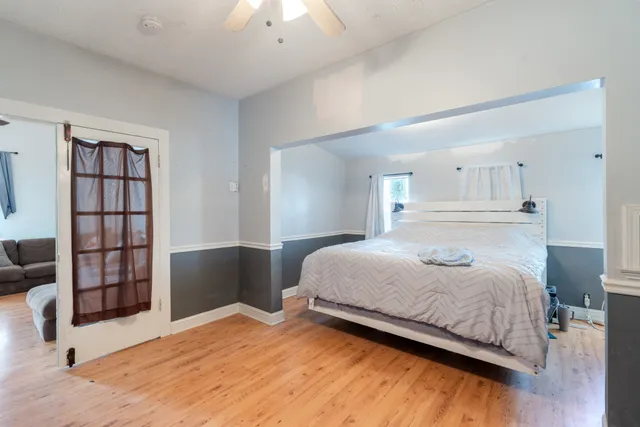 a bedroom with a bed and a cabinets