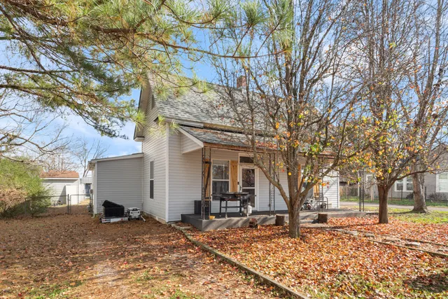 a view of a house with a snow in the yard