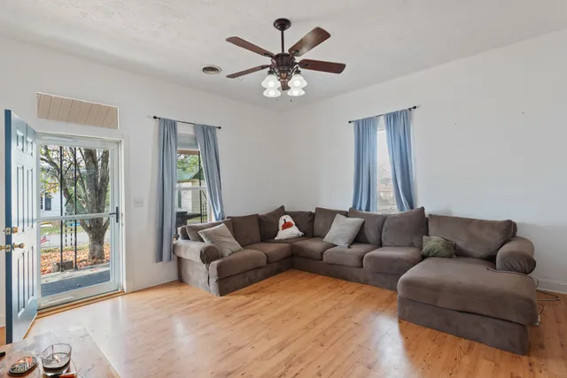 a living room with furniture and a large window