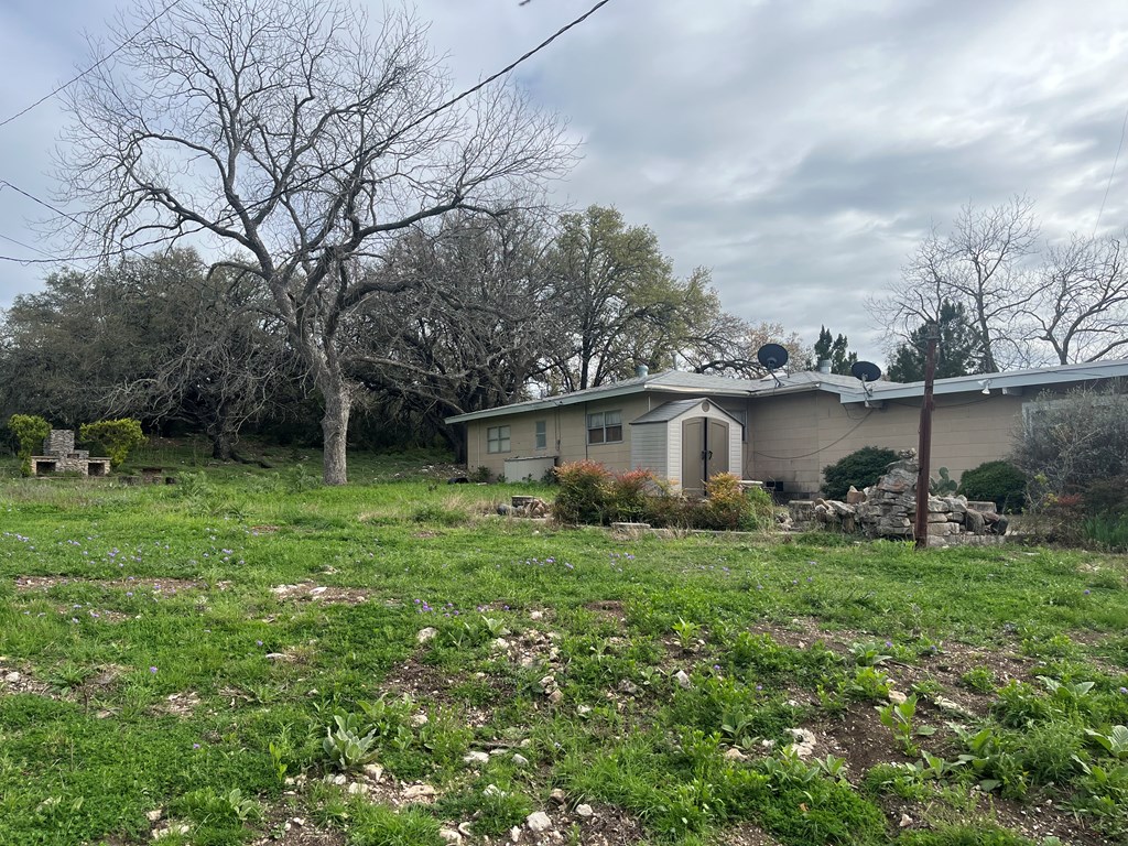 450 Kc 450 Junction, TX 76849 - Photo 16 of 39 a view of a backyard with plants and large trees