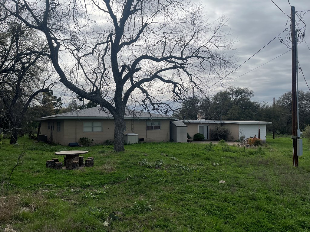 450 Kc 450 Junction, TX 76849 - Photo 19 of 39 a backyard of a house with table and chairs