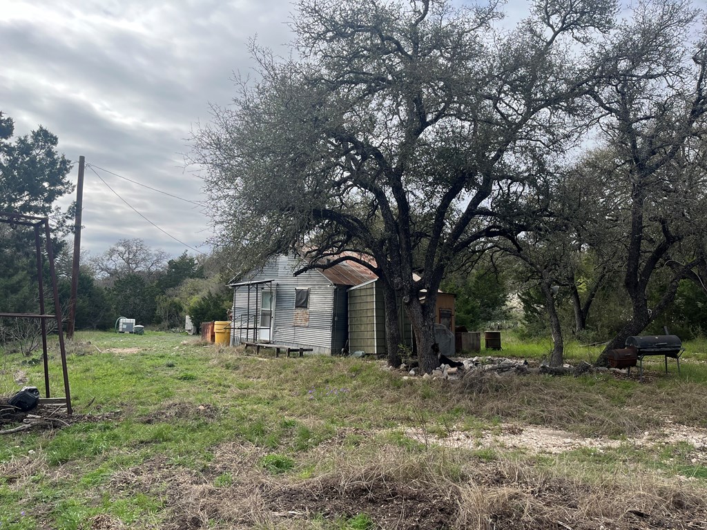450 Kc 450 Junction, TX 76849 - Photo 22 of 39 a front view of a house with a yard and trees