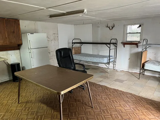 a bathroom with a toilet a sink and a mirror