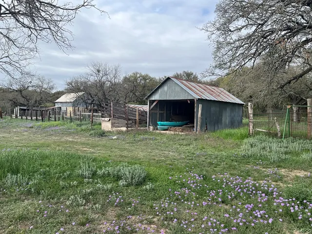 a view of house with backyard and porch