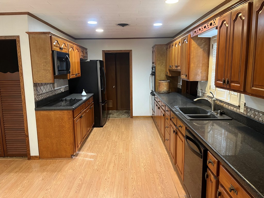 450 Kc 450 Junction, TX 76849 - Photo 8 of 39 a kitchen with stainless steel appliances a sink stove and refrigerator
