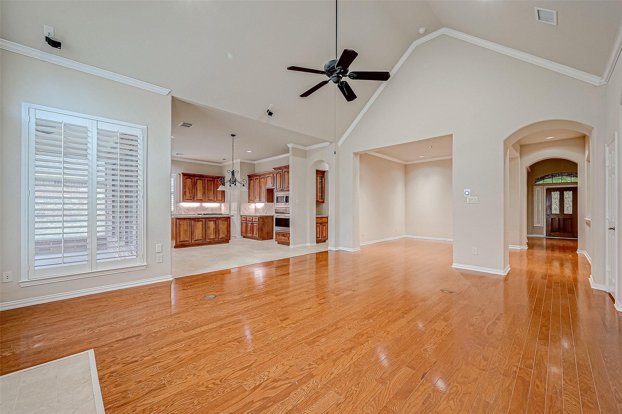 7206 Spring Meadow Lane Katy, TX 77494 - Photo 15 of 50 a view of livingroom with hardwood floor and a ceiling fan