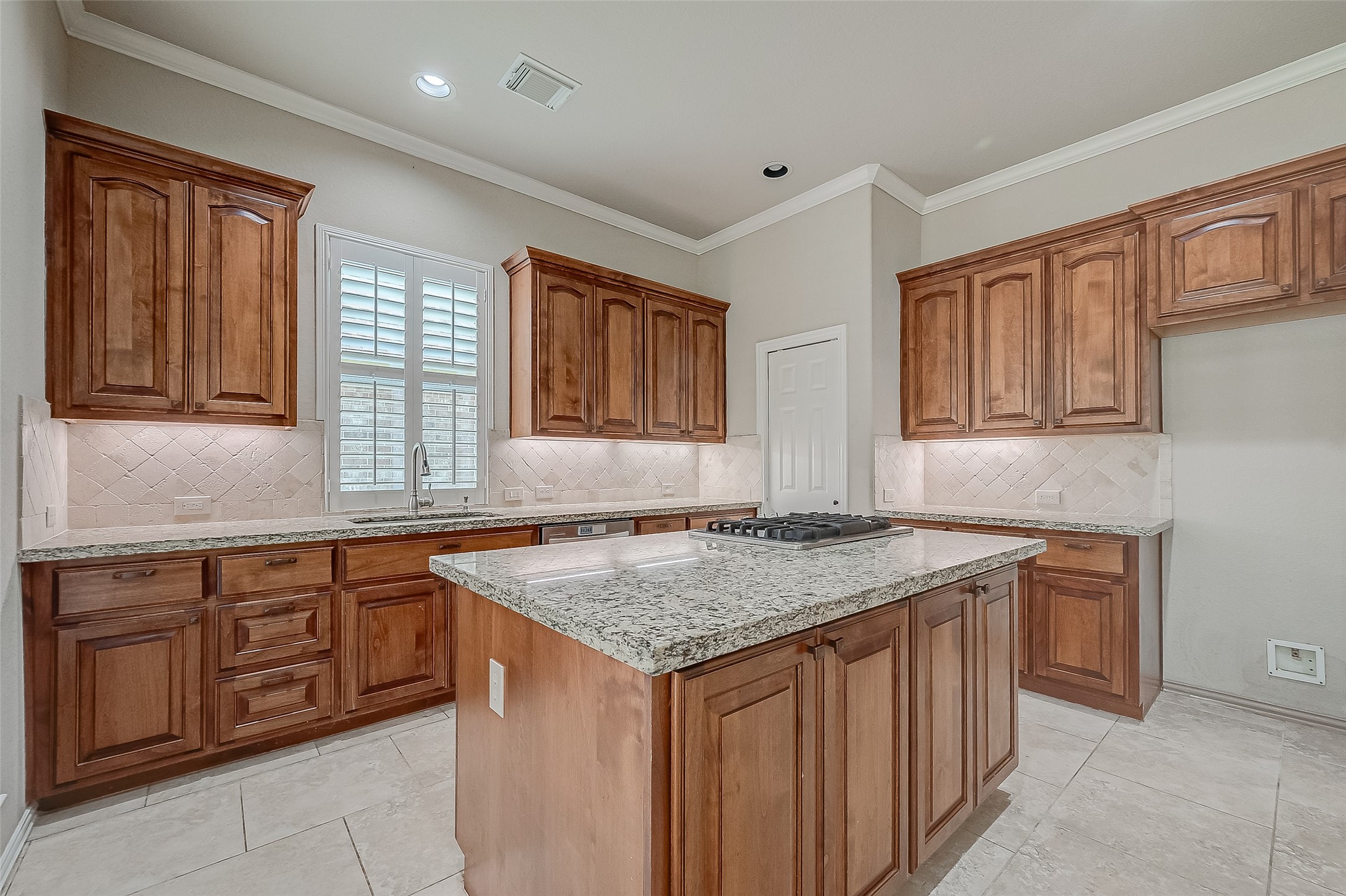 7206 Spring Meadow Lane Katy, TX 77494 - Photo 21 of 50 a kitchen with a sink stove and cabinets