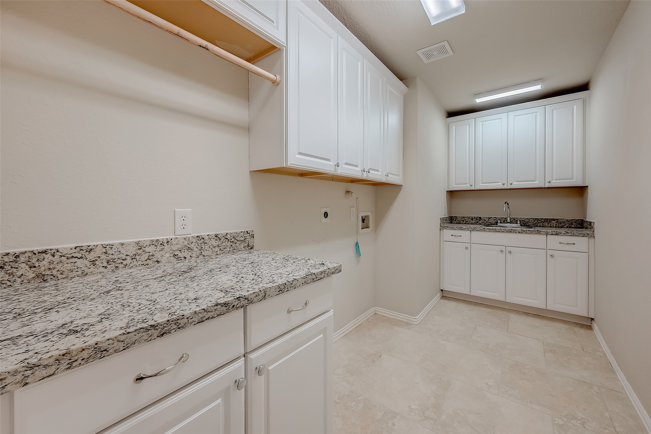 7206 Spring Meadow Lane Katy, TX 77494 - Photo 26 of 50 a kitchen with granite countertop cabinets and white appliances