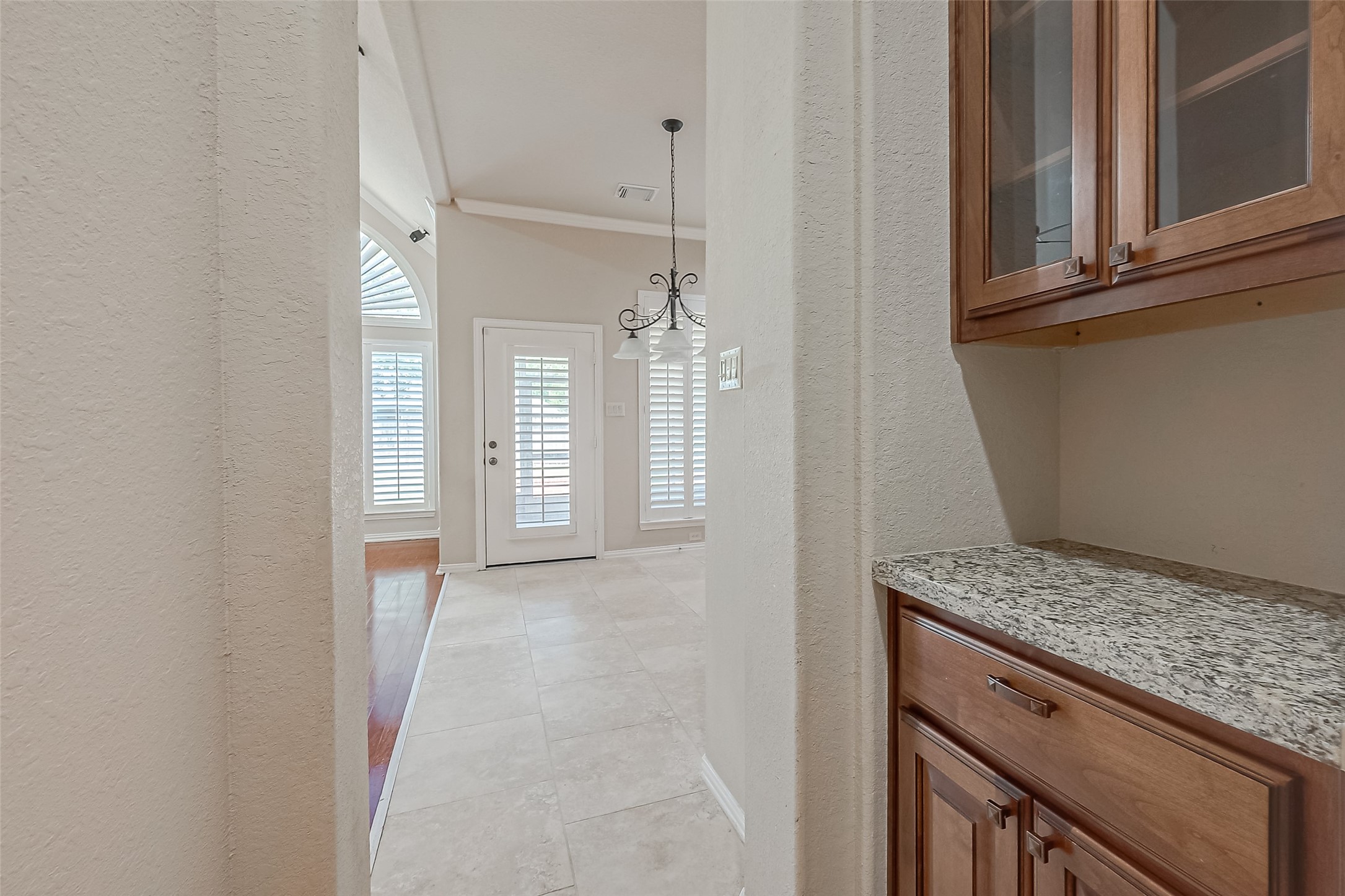 7206 Spring Meadow Lane Katy, TX 77494 - Photo 29 of 50 a view of hallway with granite countertop cabinets and dust bin