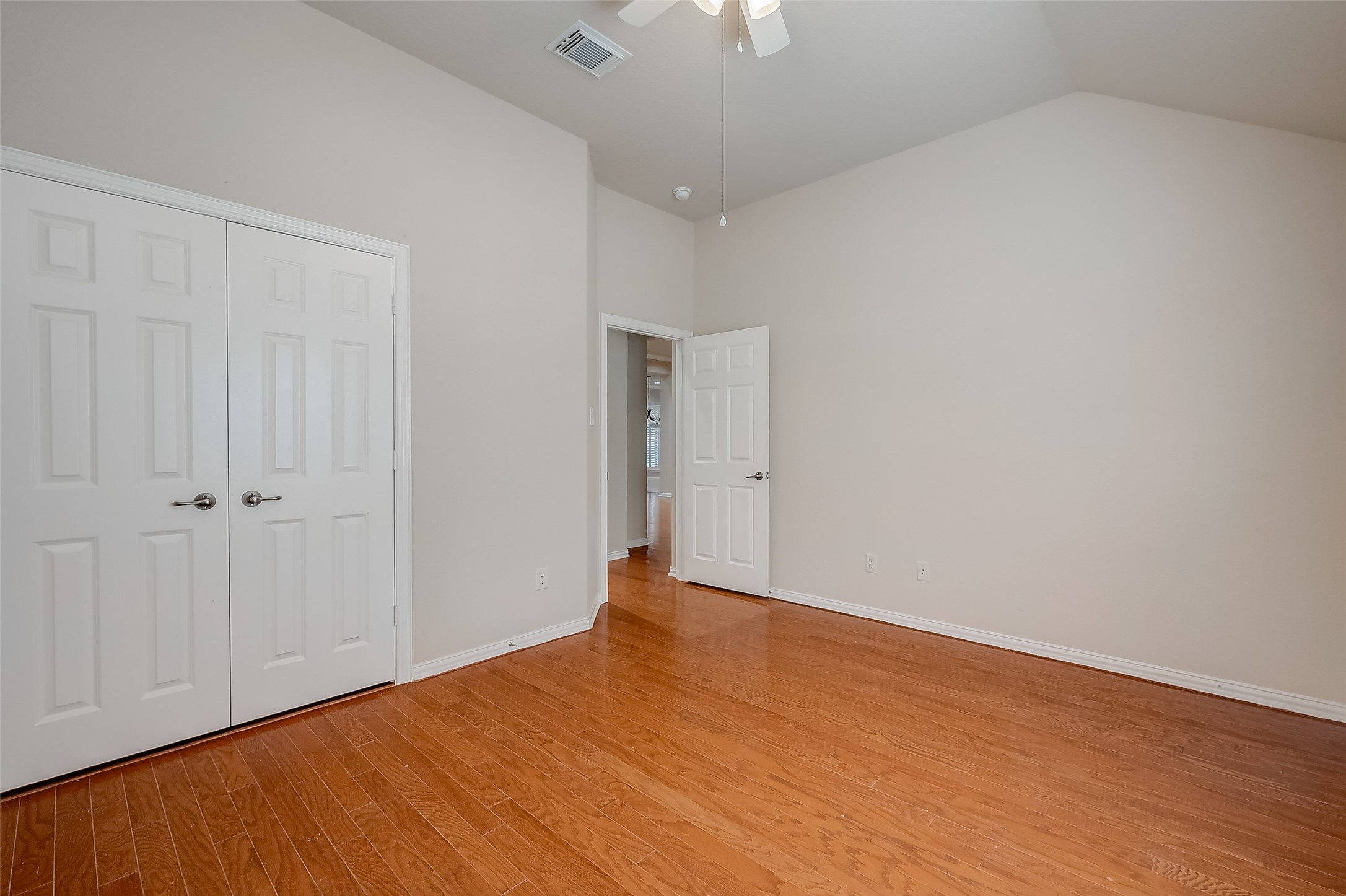 7206 Spring Meadow Lane Katy, TX 77494 - Photo 31 of 50 a view of an empty room with wooden floor