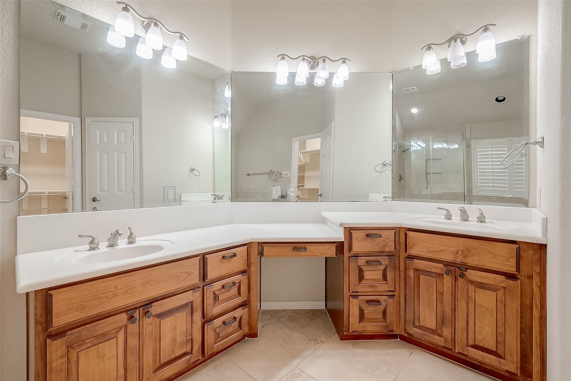 7206 Spring Meadow Lane Katy, TX 77494 - Photo 43 of 50 a spacious bathroom with a granite countertop double vanity sink and a mirror