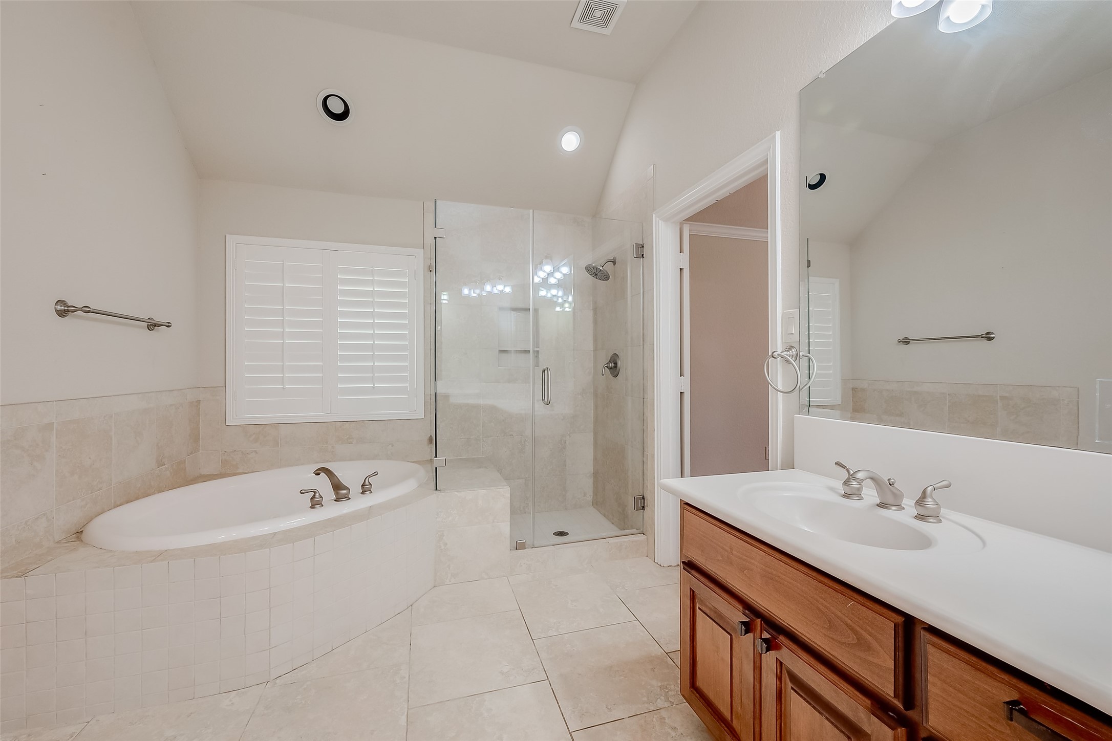 7206 Spring Meadow Lane Katy, TX 77494 - Photo 44 of 50 a bathroom with a tub sink double and mirror