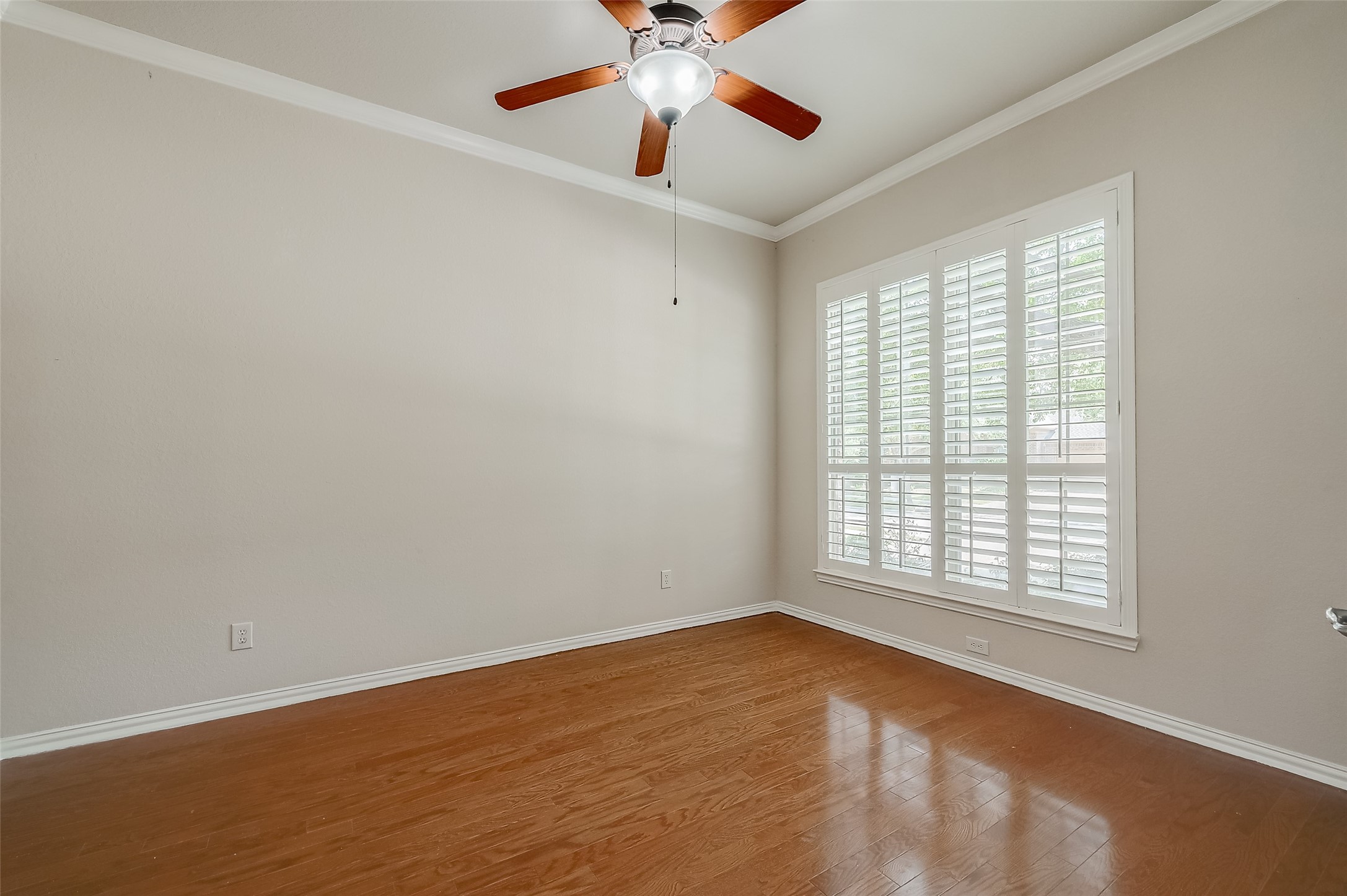 7206 Spring Meadow Lane Katy, TX 77494 - Photo 7 of 50 an empty room with a window and a fan