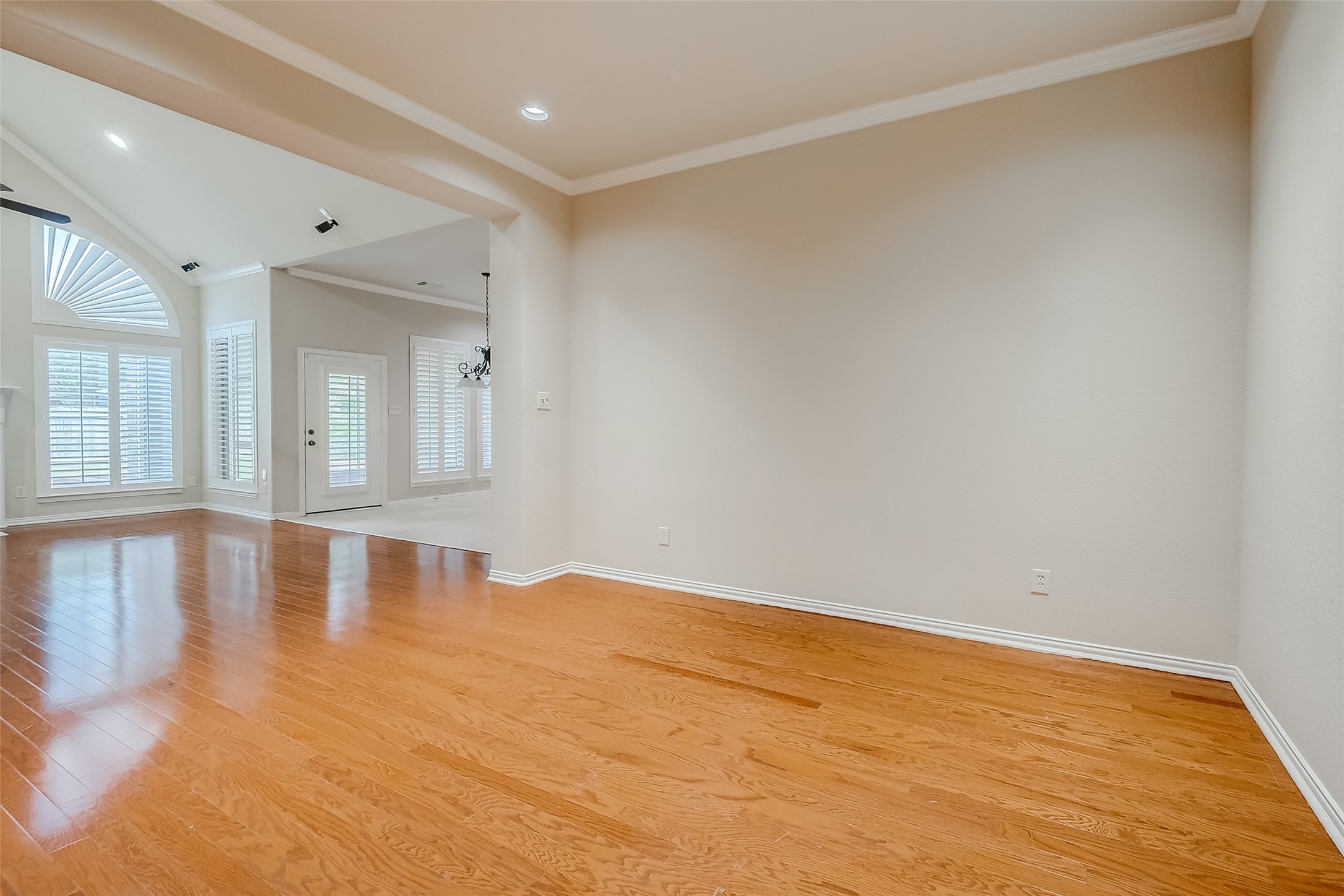 7206 Spring Meadow Lane Katy, TX 77494 - Photo 10 of 50 a view of empty room with wooden floor and fan