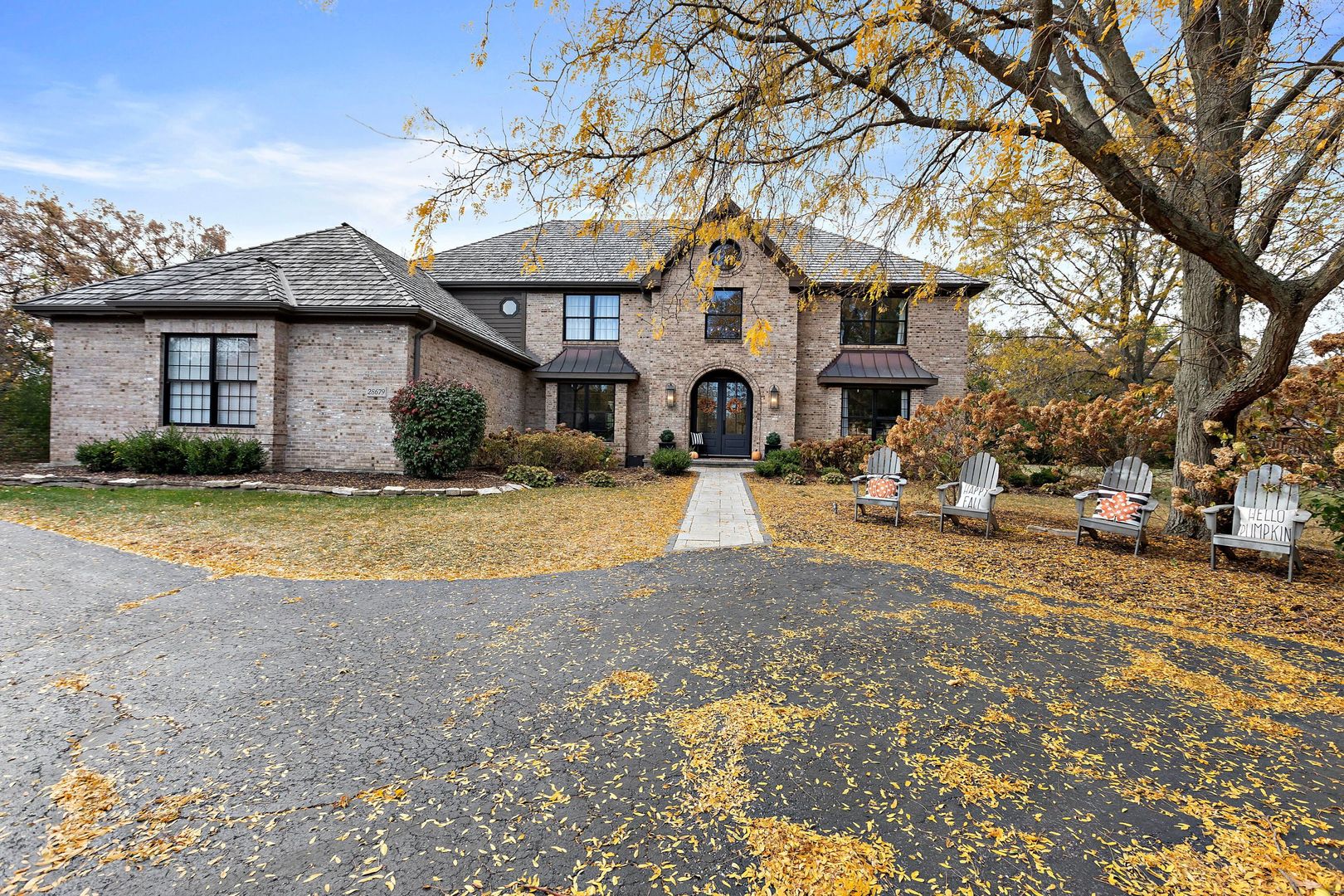 28679 West Heritage Oaks Road Barrington, IL 60010 - Photo 1 of 42 a view of a white house with a large tree with yard
