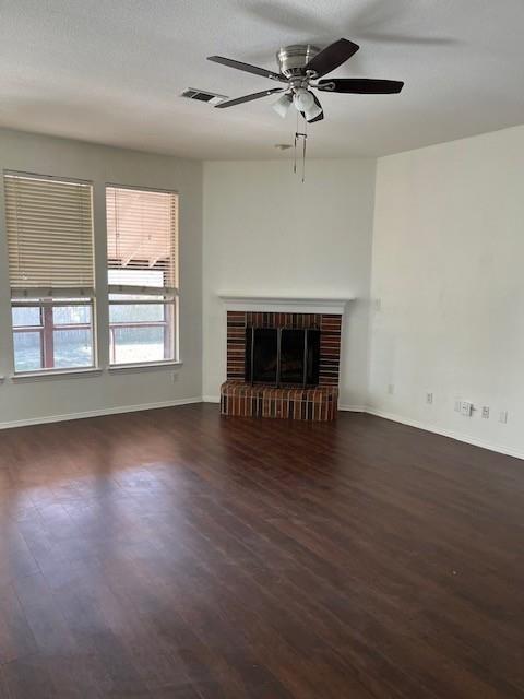 4832 Fox Ridge Lane McKinney, TX 75071 - Photo 6 of 29 a view of empty room with wooden floor and fireplace