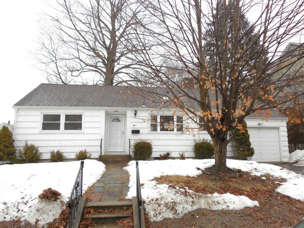 36 Merrill Street Waterbury, CT 06708 - Photo 1 of 1 a front view of a house with yard covered in snow