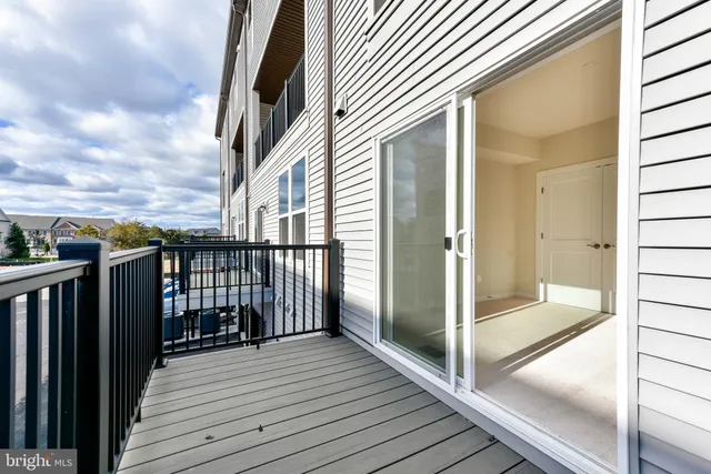 a view of a balcony with wooden floor