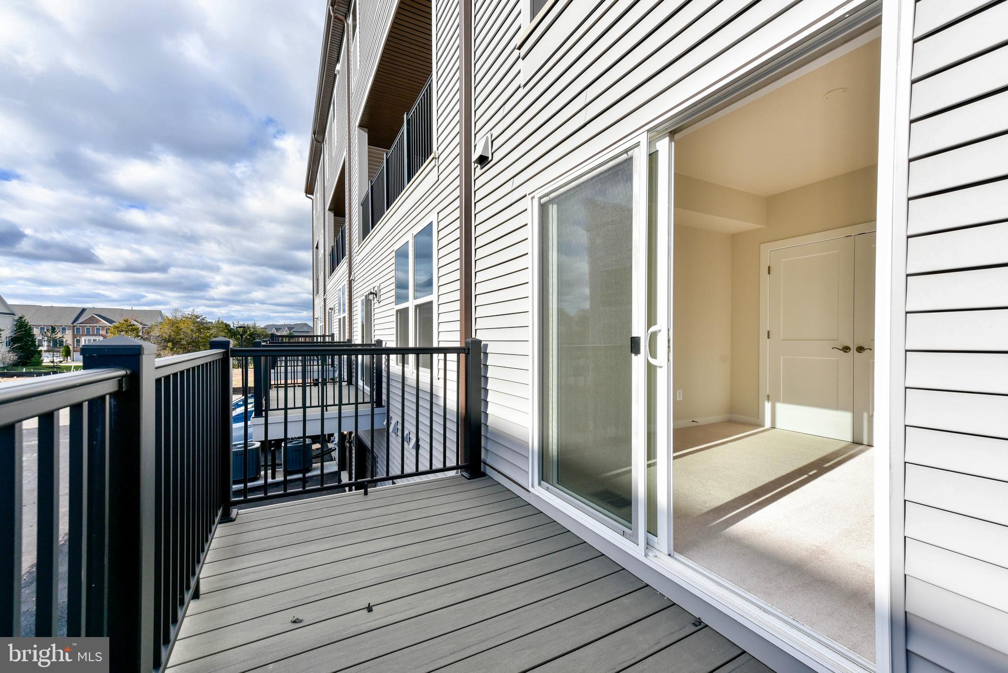 43740 Transit Square Ashburn, VA 20147 - Photo 19 of 20 a view of a balcony with wooden floor