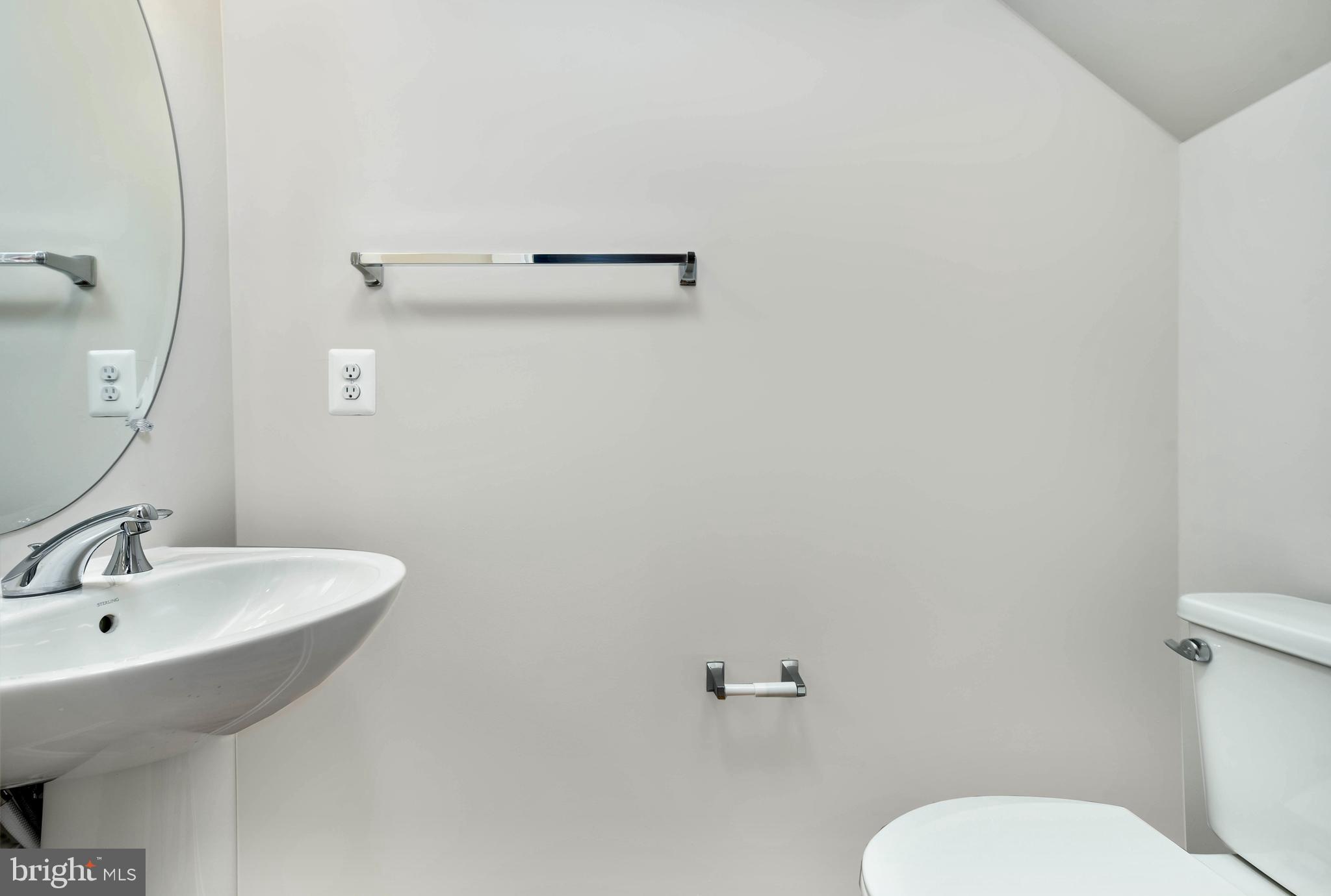 43740 Transit Square Ashburn, VA 20147 - Photo 7 of 20 a bathroom with a sink mirror and toilet