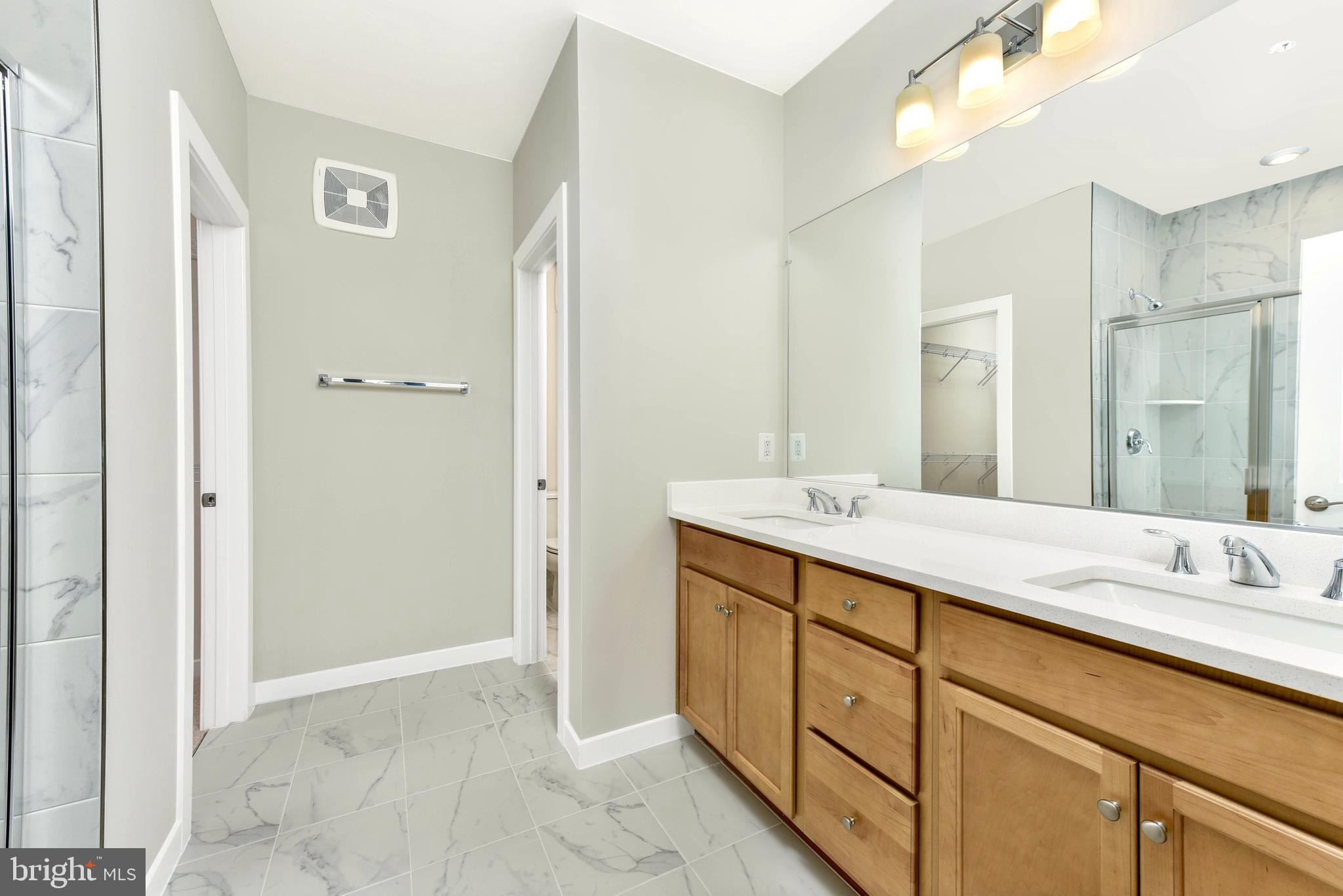 43740 Transit Square Ashburn, VA 20147 - Photo 10 of 20 a bathroom with a sink and a mirror