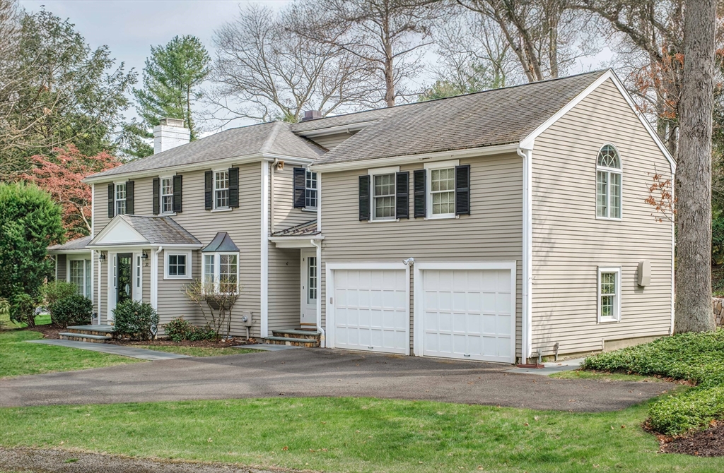 30 Audubon Road Wellesley, MA 02481 - Photo 1 of 1 a front view of a house with a garden