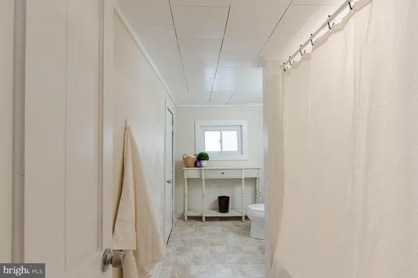 a view of a hallway with a window