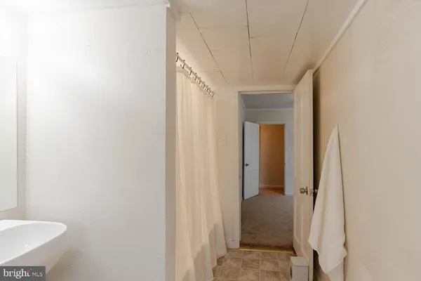 a bathroom with a sink and mirror