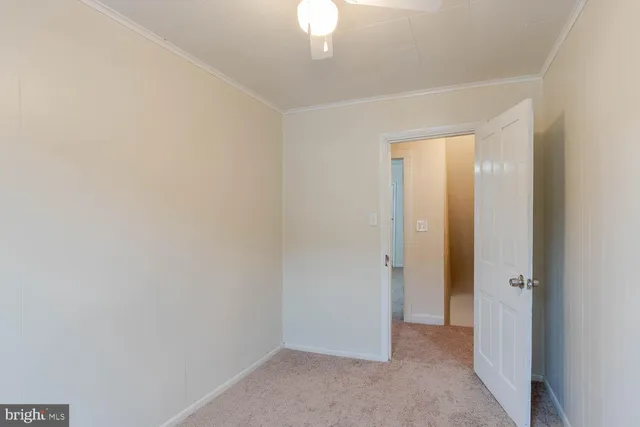 a view of a room with a hallway