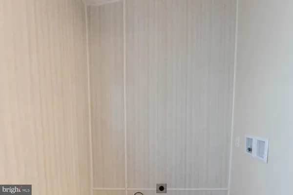 a view of roof with wooden fence