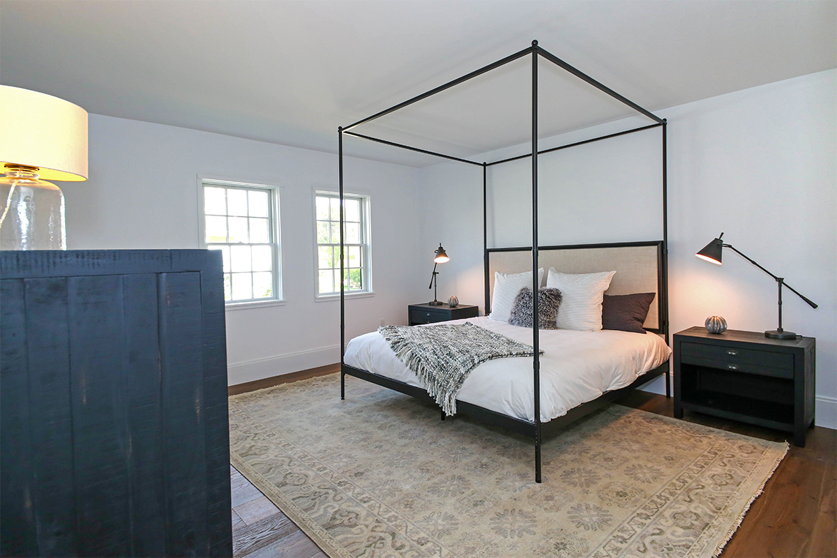 3 Blazing Star Road Nantucket, MA 02554 - Photo 13 of 38 a bedroom with a bed and dresser with mirror