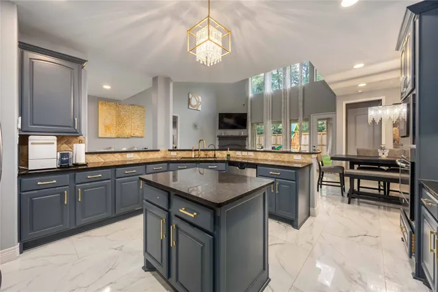 a kitchen with a sink stove and cabinets