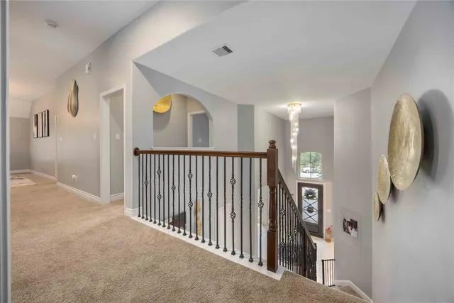 a view of a hallway view with staircase