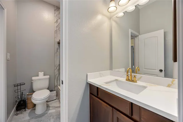 a bathroom with a shower and a toilet