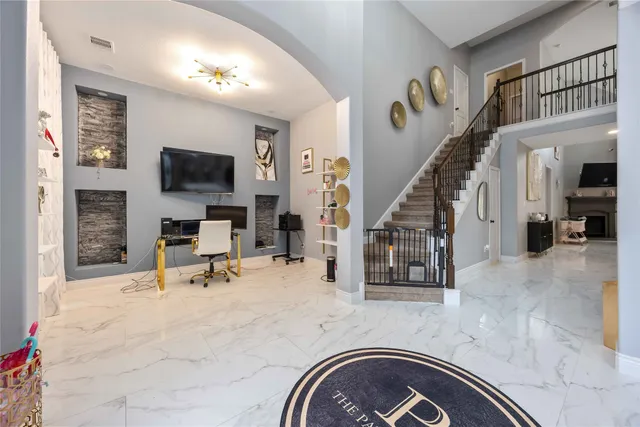 a view of a livingroom with furniture and a flat screen tv