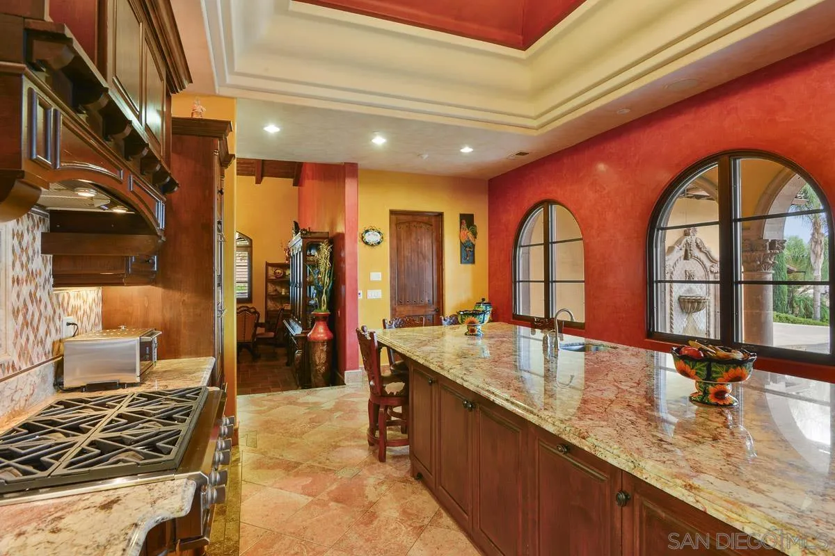 14545 Highway 67 Poway, CA 92064 - Photo 15 of 58 a kitchen with stainless steel appliances granite countertop a stove and a sink