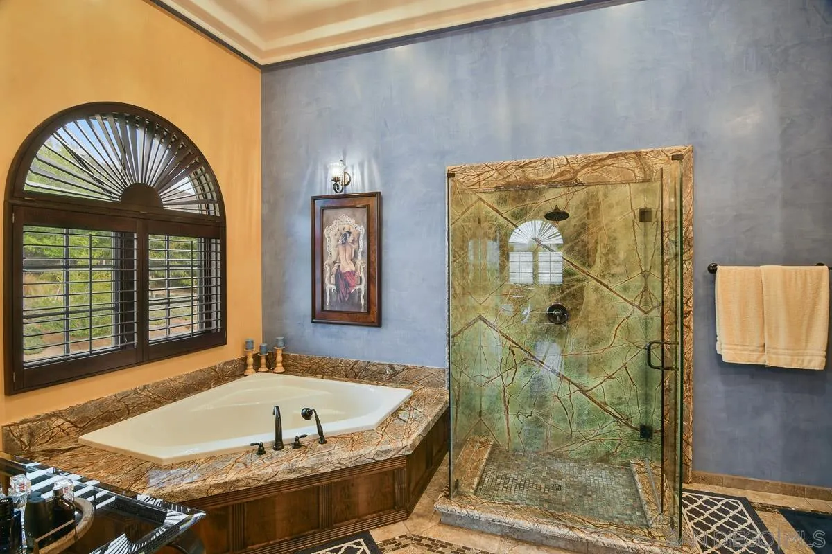 14545 Highway 67 Poway, CA 92064 - Photo 22 of 58 a bathroom with a tub and a shower
