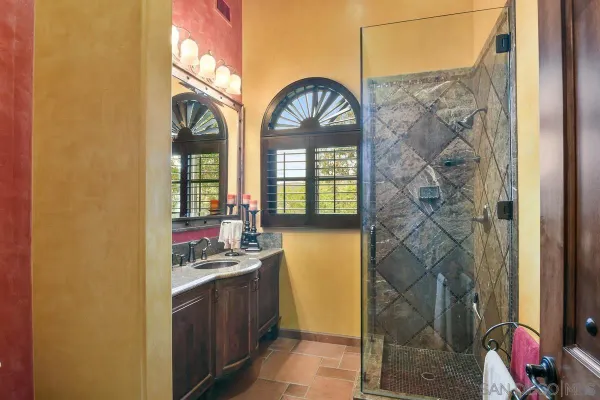 a bathroom with a sink and a large mirror