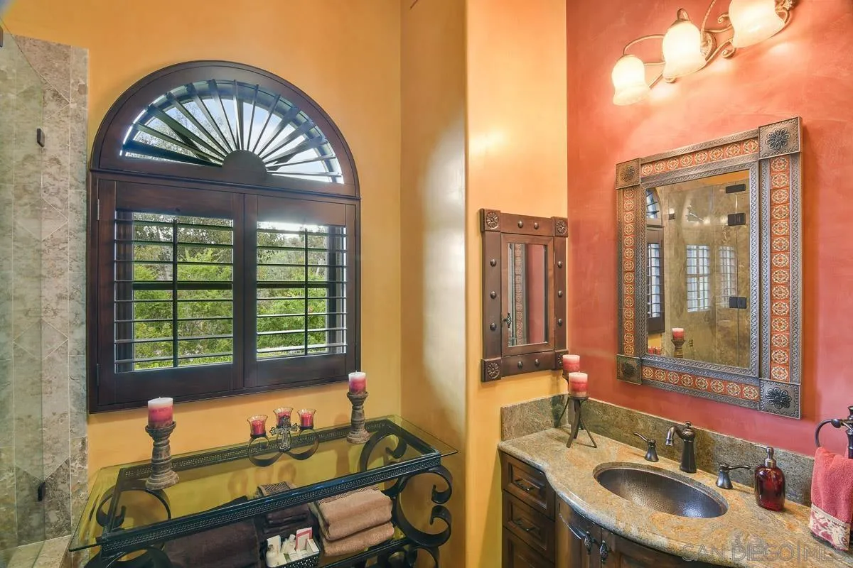 14545 Highway 67 Poway, CA 92064 - Photo 33 of 58 a bathroom with a sink and a large mirror