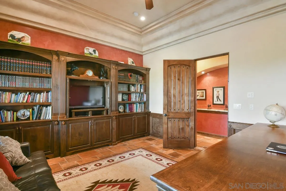 14545 Highway 67 Poway, CA 92064 - Photo 35 of 58 a bedroom with furniture and a book shelf