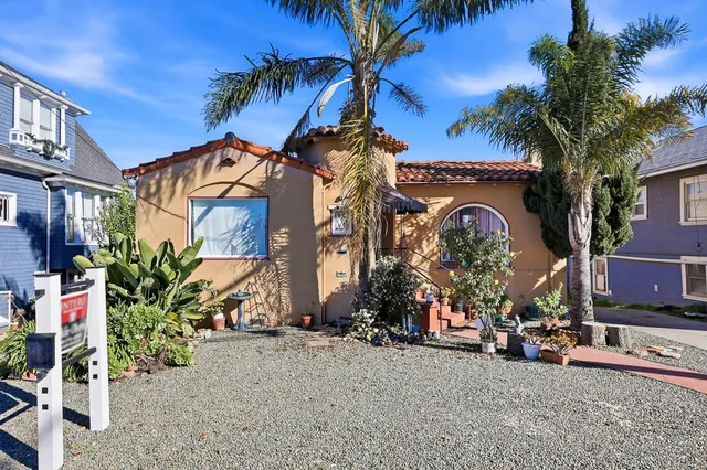a view of multiple houses with a yard