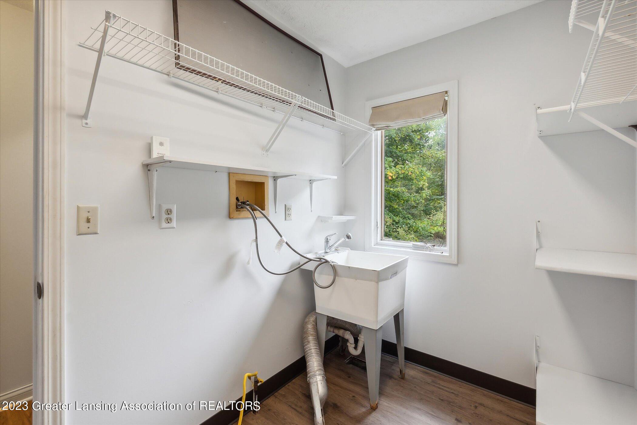 6496 Sleight Road Bath, MI 48808 - Photo 20 of 38 First Floor Laundry