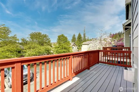 a view of a balcony with wooden floor