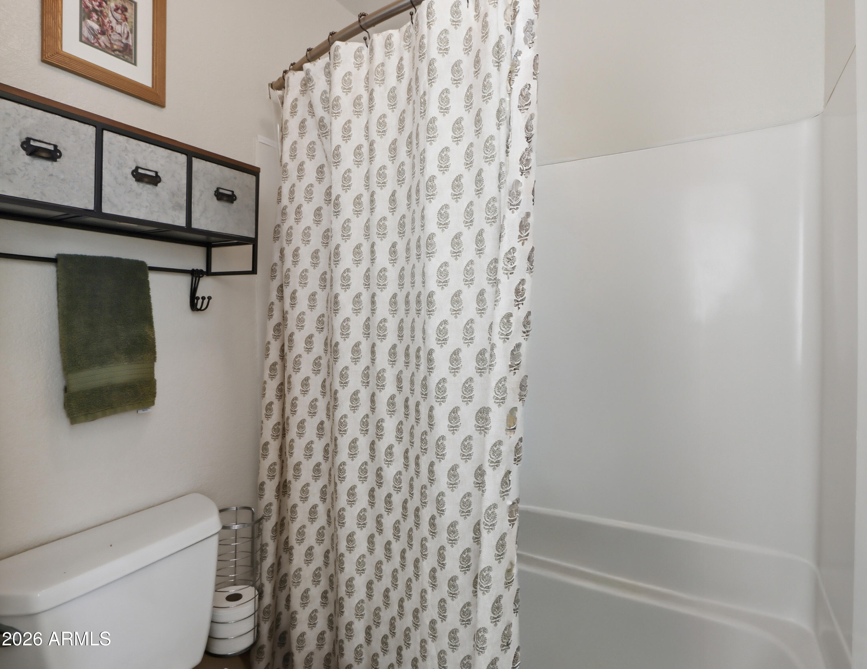 1402 East Osborn Road, Unit 2 Phoenix, AZ 85014 - Photo 19 of 29 a bathroom with a shower curtain and a toilet