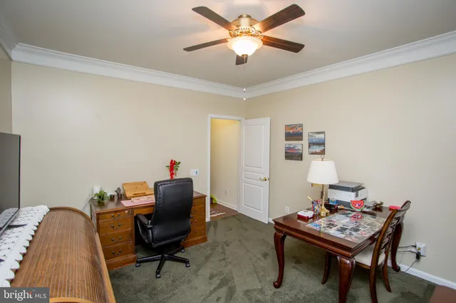 a workspace with furniture and window