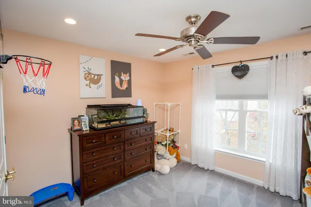 a room with furniture and paintings on the wall