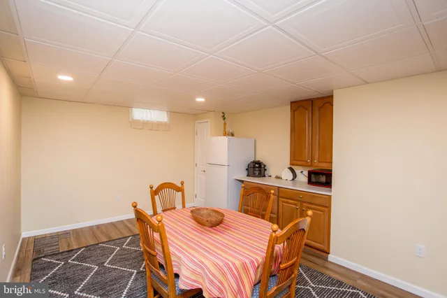 a kitchen with stainless steel appliances kitchen island granite countertop a sink and cabinets