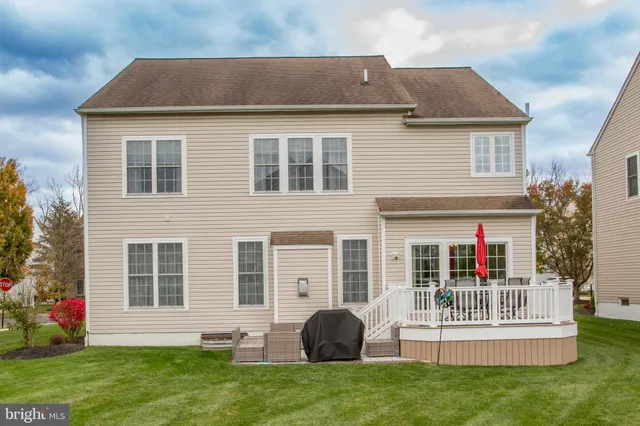a view of a house with a yard and plants